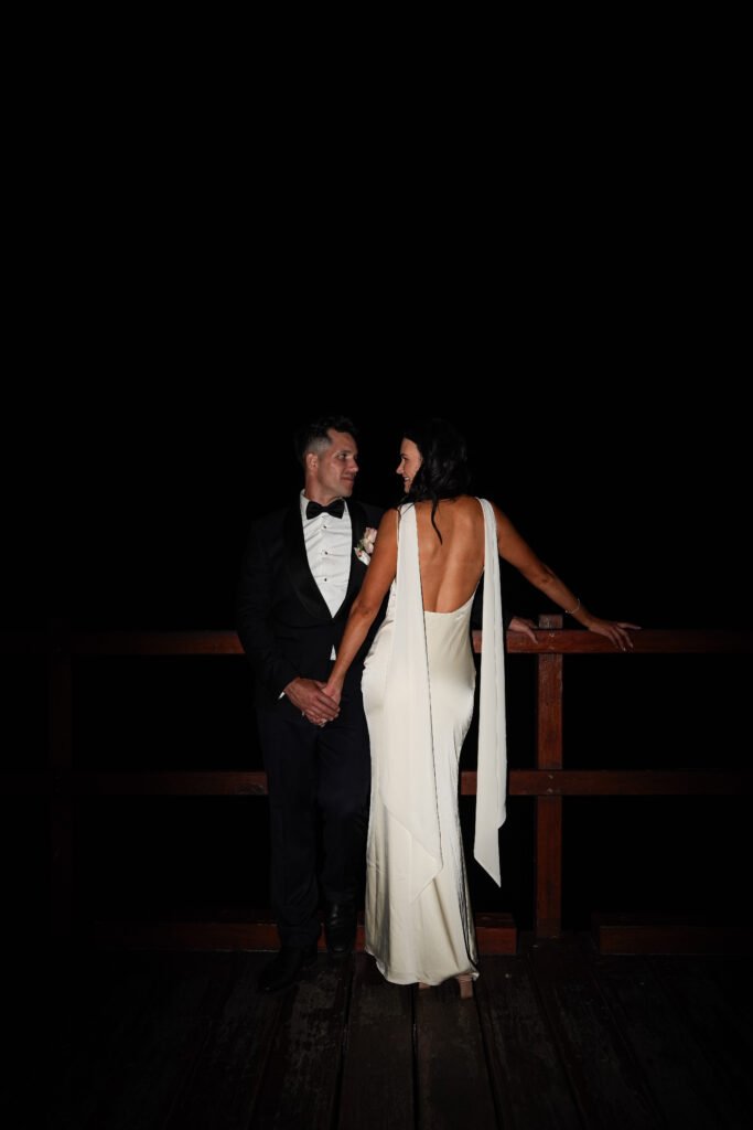 Wedding reception at Sugar Wharf in Port Douglas with guests dancing and celebrating by the waterfront
